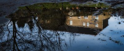 Reflections in a muddy puddle.