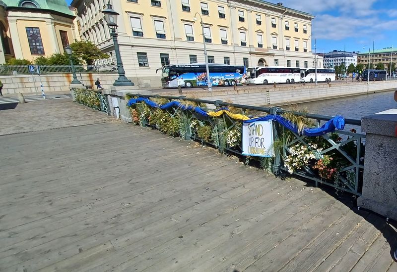German Bridge- pedestrian bridge with Ukrainian Support decor and Gothenburg Law Court building