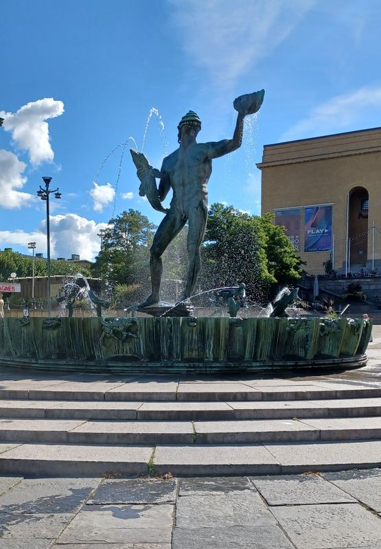 At the centre of the square presides the Poseidon statue by Carl Milles