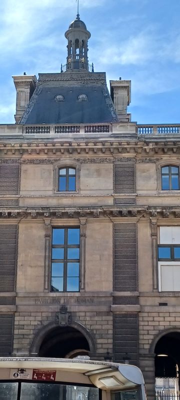 The Louvre Palace wall at the Place du Carrousel entrance
