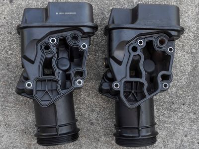 Oil Filter Bracket 06F 115 397 H Back  New on the Left and Old on the Right