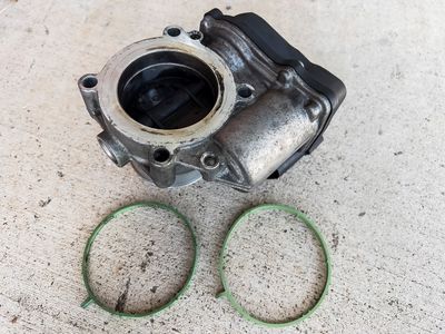 Throttle Valve with old and new gaskets