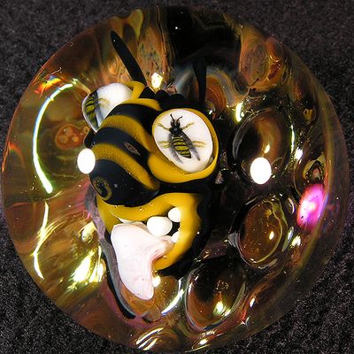 The bee is laid over Kim's gold fumed honeycomb, along with her bee murrine eyes
