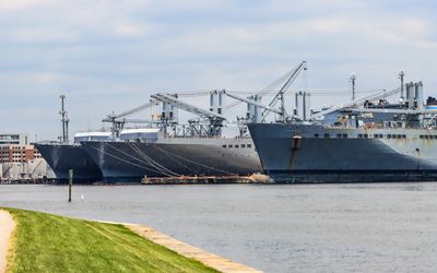 Naval ships in a dock on the Patapsco River near Ft. McHenry in Baltimore Maryland