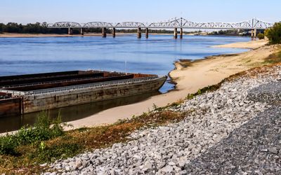 A grounded barge on the banks of the drought-stricken Mississippi River near Vicksburg Mississippi