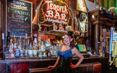 Saloon girl and the bar at the Crystal Palace Saloon in Tombstone AZ