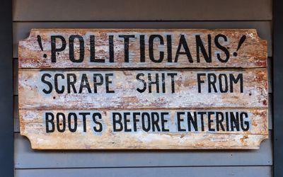 Sign outside of a saloon in Tombstone AZ