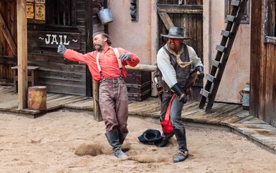 Johnny Ringo throws a punch on the streets of Tombstone AZ