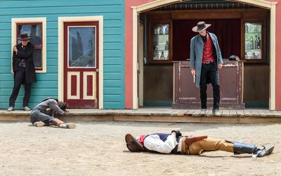 A wounded Morgan Earp and Doc Holliday after the gunfire stops at the Gunfight at the OK Corral