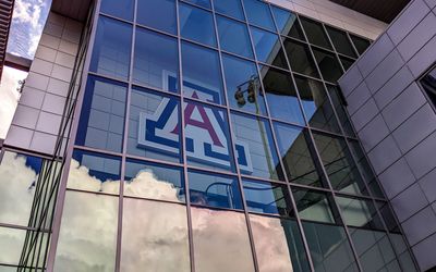 Clouds reflected in the windows on the northeast side of Arizona Stadium