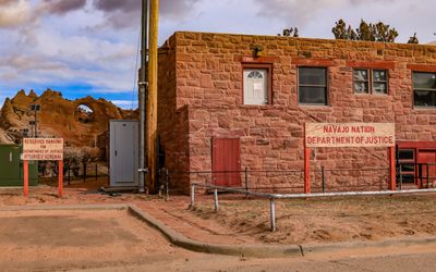 The Department of Justice building with Window Rock in the distance in the Navajo Nation at Window Rock
