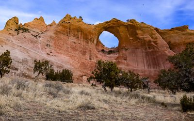 Birds soar over Window Rock in the Navajo Nation at Window Rock