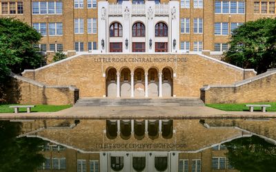 Front of Little Rock Central High School reflected in the pool in Little Rock Central HS NHS