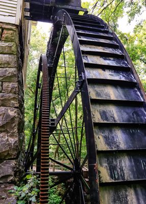 Side view of the Mill Springs Grist Mill water wheel in Mill Springs Battlefield NM