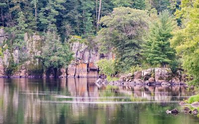 View of the cliffs beyond an island on the St. Croix River in St. Croix NSR