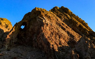 Window in a formation lit by early morning sunlight in Valley of Fire SP