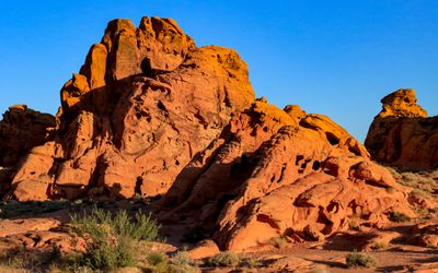 Early morning sunlight sets a sandstone formation aglow in Valley of Fire SP