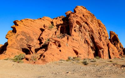 Bright red formation is highlighted by early morning sunlight in Valley of Fire SP