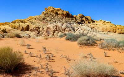Sand dune at the foot of a formation along the White Domes Road in Valley of Fire SP