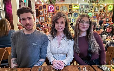 Nephew Brandon, sister Vicky and niece Alyssa at a holiday dinner