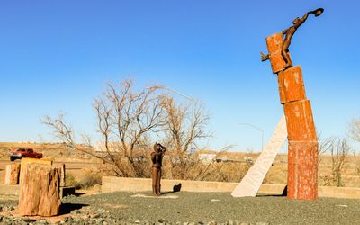 Holbrook, Arizona city welcome pullout featuring a cowboy riding petrified wood 