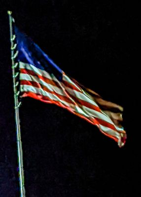 Nighttime flag image at the Hilltop RV Park in Ft. Stockton, Texas