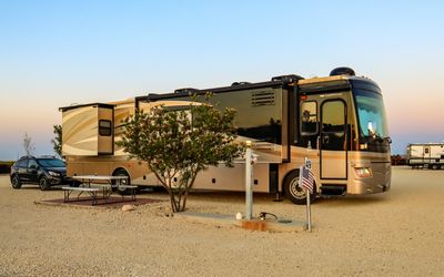 RV with Subaru attached parked for the night at the Hilltop RV Park in Ft. Stockton, Texas
