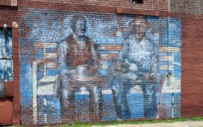 Old mural on a brick building in Tutwiler, Mississippi