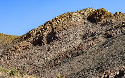 Ocotillo plants top a layer formation in Castner Range NM