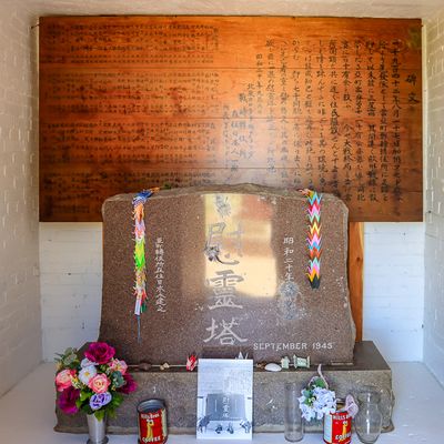 Granite stone and wooden memorial board in the columbarium in the cemetery in Amache NHS