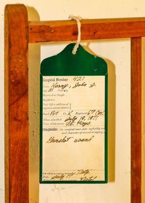 Soldier/patient hospital tag attached to the bed in Fort Larned NHS
