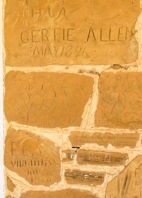 Nineteenth century graffiti carved into a building in Fort Larned NHS