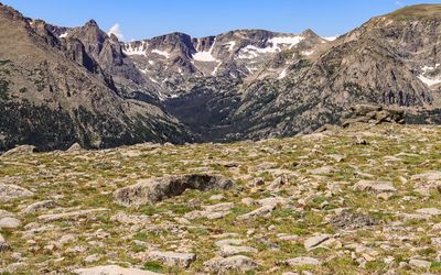 View of a mountain ridge across the rocky tundra in Rocky Mountain NP