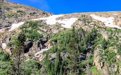 Snow among the rocks high above the Old Fall River Road in Rocky Mountain NP
