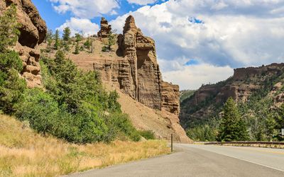 Towering cliffs along US 14 in Shoshone National Forest 
