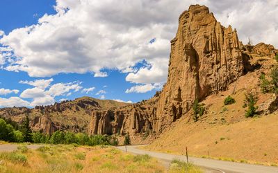 Rock formation towers over US 14 in Shoshone National Forest