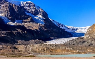 The Athabasca Glacier with Sunwapta Lake in the foreground in the Jasper NP Icefield