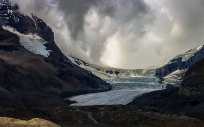 View of the Athabasca Glacier as snow drops from above in the Jasper NP Icefield