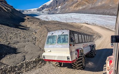 An Ice Explorer climbs a 32-degree road away from the Athabasca Glacier in the Jasper NP Icefield