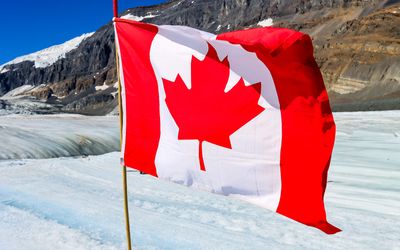 The Canadian flag flies on the Athabasca Glacier in the Jasper NP Icefield
