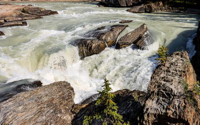 The raging Kicking Horse River as it funnels into the Natural Bridge in Yoho NP