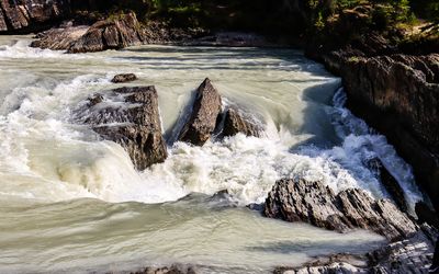 The powerful Kicking Horse River as it enters the Natural Bridge in Yoho NP