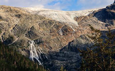 Illecillewaet Glacier terminus and a large glacier runoff waterfall in Glacier NP