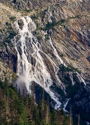 Closeup view of a glacier runoff waterfall below Illecillewaet Glacier in Glacier NP