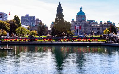 Welcome To Victoria garden with the province capitol building in the background in Victoria BC
