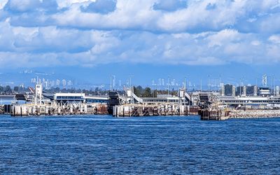 View of the ferry dock with the city of Vancouver in the distance along the Caravan Ferry Crossing Route
