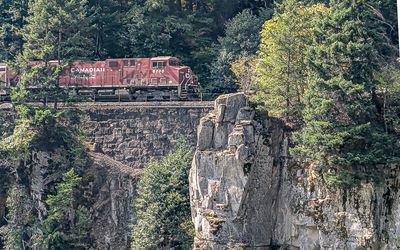 Canadian Pacific Railway engine roars through Fraser Canyon at Hells Gate