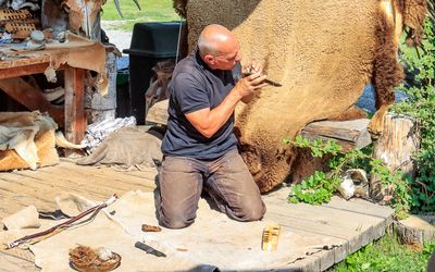 Leo Downey demonstrates how to start a fire at the Rocky Mountain Buffalo Ranch