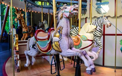 Closeup of hand-carved animals on the Rose Carousel in Butchart Gardens