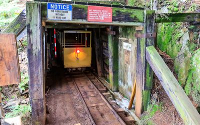 Underground train emerges from the mining tunnel at the Britannia Mine National Historic Site